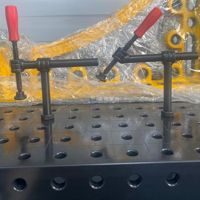 Telescopic Welding Table Clamp in use showing 180° and 45° modes